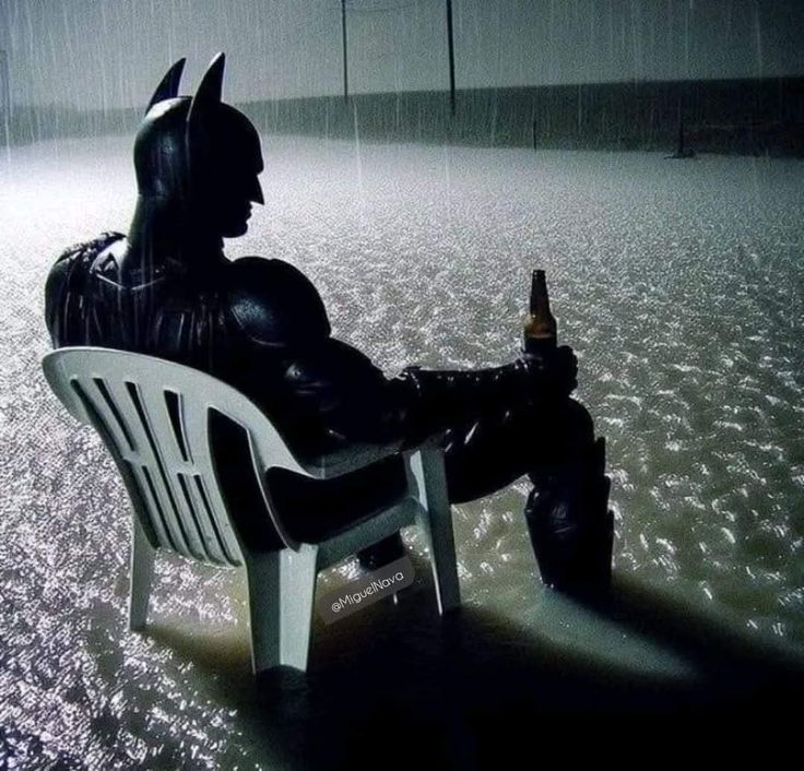 Sad batman in rain